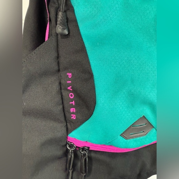 The North Face Pivoter black, pink, teal backpack. - Picture 6 of 9